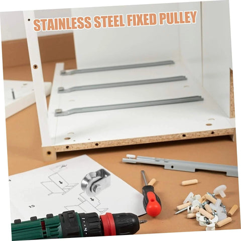 Stainless Steel Fixed Pulley Bearing For Sliding Doors And Gates in assembly kit with instructions and tools on brown surface.