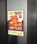 8.5x11 Clear Acrylic Sign Holders With No Drilling Mount displaying bakery menu on glass door