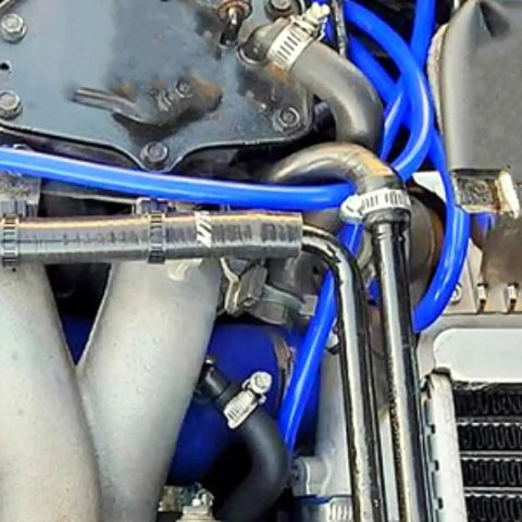 Top Notch 6-Pack 5FT High Performance Black Silicone Vacuum Tubing Hose Kit For Cars With 1/8 To 3/8 Inch Sizes And Tough High Heat Resistant Lines Built To Last. Blue silicone vacuum hoses installed in a car engine bay