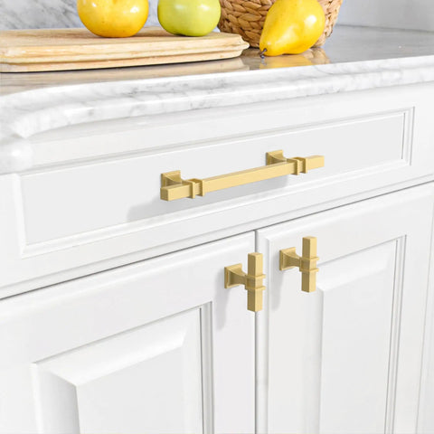 Brushed gold cabinet pulls with 5 inch hole center on white cabinets, part of Turn Your Kitchen And Bath Into Fire set, 20 pack