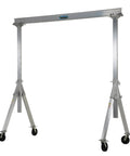 Built Like A Tank Aluminum Adjustable Height Gantry Crane With Swivel Nylon Casters And Four Way Safety Locks 15 Foot Width Reaches Twelve Feet High Lifts Two Thousand Pounds Smoothly - Full view of gantry crane in use.