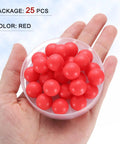 25 Piece Set Polypropylene Bearing Balls 14mm Red Plastic Rollers in hand, ideal for heavy duty mechanical projects and repair.