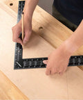 Built Tough 16 X 24 Inch Steel Framing Square Featuring Etched Rafter Tables And Sharp Measurement Lines For Skilled Carpenters and DIY Builders, marking wood layout.