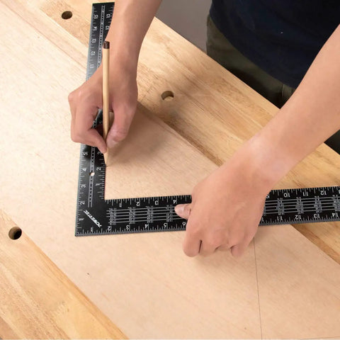 Built Tough 16 X 24 Inch Steel Framing Square Featuring Etched Rafter Tables And Sharp Measurement Lines For Skilled Carpenters and DIY Builders, marking wood layout.