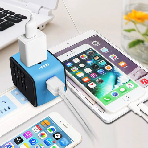 Universal Travel Adapter With Dual USB Fast Charge All In One International Power Converter for UK EU AU Asia in use on tablet
