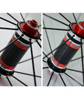 Close-up of hub on 700C Road Wheelset With 30mm Aluminum Double Wall Rims, Quick Release Front 100mm Rear 130mm, Matte Black, CV Brake Compatible