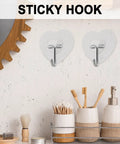 Heavy Duty Adhesive Wall Hooks With Slick Grip Keep Your Towels And Gear Locked In Place Zero Drilling Hassle Clear Transparent Look Fits Any Room Flawlessly with heart-shaped design, ideal for bathroom use.