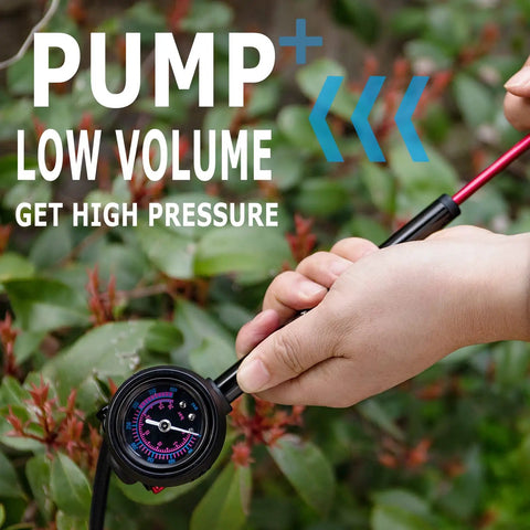 Using high pressure bike shock pump with no loss schrader valve for front fork and rear suspension 400 PSI gauge outdoors
