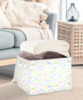 Rugged Foldable Storage Bin With Flip Top Lid And Sturdy Handles For Home Organization Bedroom Closet Collapsible Box Crafted With Durable 300D Oxford Fabric And Velcro Closure To Secure Your Gear Big Time storing blankets in a cozy living room.