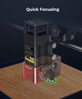 5W Laser Engraver focusing on wood with 500x500mm honeycomb bed for precise DIY crafts, showing quick focusing feature.