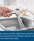 Heavy Duty Two Handle Kitchen Faucet With Pull Down Sprayer And Four Hole Deck Mount In Sleek Brushed Nickel Finish, side sprayer in use.