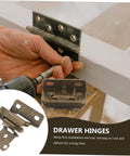 Drawer hinges being installed on wooden cabinet with visible screws