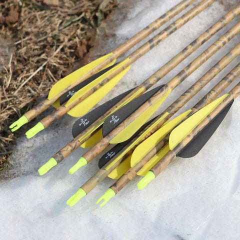 28 Inch Carbon Arrows For Target And Hunting, Spine 500, 0.309 Inch Outer Diameter, pack of 12 displayed on snow