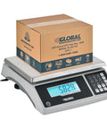 Heavy Duty Weight Counting Scale With LCD Display 60 Lb Capacity 0.002 Lb Readability Industrial Counting Scale With RS 232 Eleven And Five Eighths Inch By Thirteen And One Half Inch Platform Fast Accurate Box And Part Counting, showing a box on scale with a digital reading.