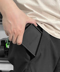 Person holding Portable Tri Fold Silicone Tool Tray With Magnetic Sheets Included Heat Resistant And Flame Retardant Durable Silicone