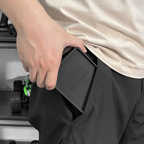 Person holding Portable Tri Fold Silicone Tool Tray With Magnetic Sheets Included Heat Resistant And Flame Retardant Durable Silicone