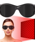Dope Red Light Therapy Glasses With Broad Spectrum 200 To 2000nm Protection worn by woman, black frame, red light panel displayed