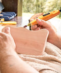 Using Corded Rotary Tool Kit With 105 Accessories, Mini Power Tool 18000 RPM for crafting on wood outdoors.