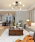 Living room with Sputnik Chandelier Pendant Light With 180 Degree Adjustable Arms Four Lights Mid Century Modern Nordic Ceiling Fixture In Black