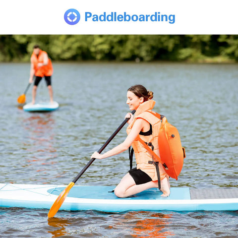 Person paddleboarding with bright orange 35L Swim Buoy Dry Bag Floating Backpack With Shoulder And Waist Straps.