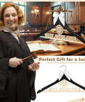 Wooden Judge Coat Hanger With Bow And Balanced Scale Motifs Dope Gift displayed on courtroom desk with gavel