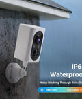 Wireless Outdoor Security Camera Set With 355 Degree Pan 2K Color Night Vision Battery Powered WiFi Enabled Motion Detection Two Way Talk IP65 Weatherproof Spotlight Siren SD Cloud Storage 2 Pack No-Hassle Setup installed on an exterior wall in rain.