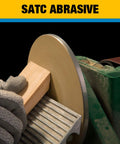6-inch PSA sanding disc on a grinder; adhesive-backed aluminum oxide for wood sanding.