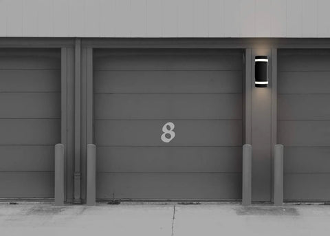 Installed 4 Pack Semi Cylinder Up And Down Outdoor Wall Light in Aluminum, Waterproof IP65, illuminating garage area, modern American style.