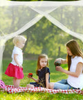 Family sitting under Four Corner Bed Mosquito Net For Canopies And Travel, Rectangular Mesh Netting With High Density Breathable Fabric
