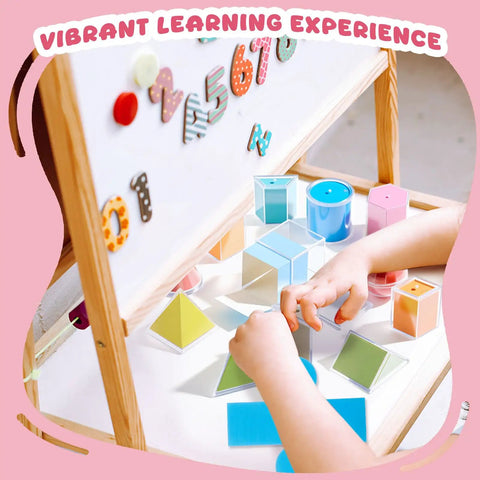 Child playing with Hands On Geometry Kit With 12 Geometric Solids And 12 Folding Nets, multicolored 3D shapes, and folding cards.
