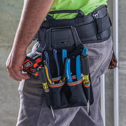 Tradesman Pro Modular Trimming Pouch With Belt Clip For Click Lock System in use, holding tools while attached to a belt.