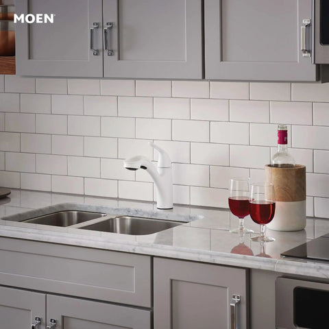 Brecklyn Glacier White One-Handle Single-Hole Kitchen Faucet With Pull-Out Sprayer Power Clean Reflex System installed on countertop