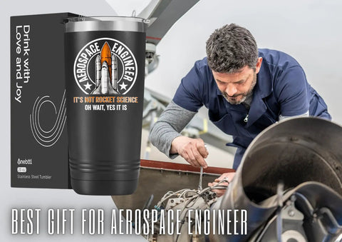 Space Themed 20oz Stainless Steel Tumbler With Lid, Double Wall Vacuum Insulated Travel Coffee Mug For Men, Hilarious It's Not Rocket Science Oh Wait Yes It Is Quote With Rocket Launch Logo Gift displayed beside engineer working on machinery.