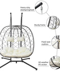 Two Person Outdoor Egg Swing Chair With Stand For Patio Garden Or Balcony Cushioned Wicker Hammock Chair Weather Resistant And Sturdy Dual Hooks Perfect For Chillaxing Together On A Sunny Day showing steel frame, cushion, and wicker close-ups