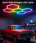 RGB Hexagon Garage Lights 240W 24 Pack LED Honeycomb Ceiling Lights installed in garage with truck, multicolor lighting visible.