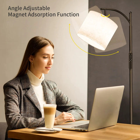 Arc Floor Lamp With Remote And Stepless Dimming Dope Modern Metal Standing Lamp With Hanging Lampshade For Living Room Bedroom Or Office Black Finish Easy Color Temp And Brightness Control shown in use next to a woman working on a laptop.