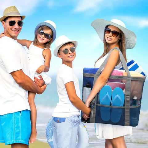 Family at beach with Big Mesh Beach Bag For Fam Trips Fits Four To Six Towels Water Bottles Sunscreen And Gear Nine Pockets