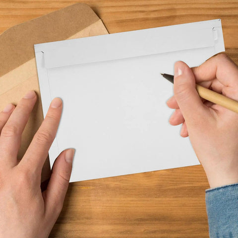 A4 Gray White Self Sealing Paper Mailing Envelopes Thickened For Documents And Photos 30 Pack with easy seal flap on desk