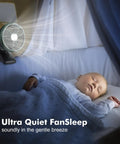 Sleeping baby next to Clip On Camping Fan With LED Lantern Magnetic Base and Hanging Hook, casting soft light.