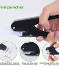 Hand holding heavy duty slot punch handheld hole puncher all metal ID card puncher slotting tool against white background