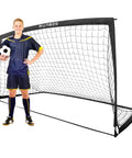 Boy standing next to 9x5 Feet Portable Kids Soccer Goal For Backyard Practice With Carry Bag Foldable Trapezoidal Frame Durable 420D Oxford Cloth Net Ideal For Teens Juniors And Adults Easy Setup Soccer Goal.