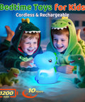 Two children in dinosaur pajamas playing with the Totally Adorable Dino Night Light For Kids 3 To 8 Sixteen Color Silicone Dimmable Battery Operated 12 Hour Use Dino Toy Night Light For Boys Girls Toddlers Bedroom Decor Gift on a bed.