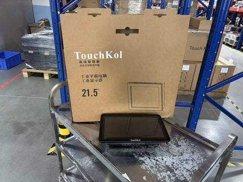 21.5 Inches Industrial Touchscreen Panel PC Running Windows 11 Pro With Intel Celeron J6412 Chipset on display with packaging in warehouse.