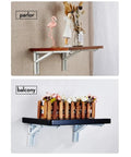Two Pack Folding Triangle Shelf Brackets Wall Mounted for Tools and Benches 12 Inch White Heavy Duty Spring Support Space Saver for Shelves and Tables Easy Fold Up Design showcasing a wall-mounted shelf in a parlor and balcony with decorative items.