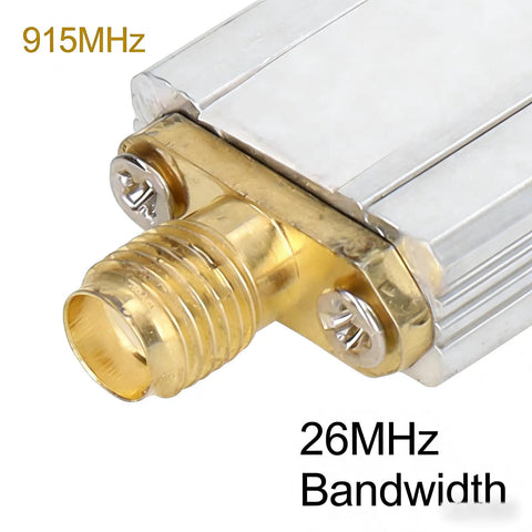 Close-up of 915MHz Bandpass Receiver Filter With SMA Interface, 26MHz Bandwidth showing SMA connector and metallic casing.