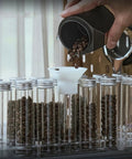 Premium Coffee Bean Storage Tubes With Display Stand And One Way Valve To Keep Your Daily Grind Sealed Tight and Locks In Maximum Freshness for Every Bold Morning Cup You Crave with glass tubes holding coffee beans.