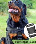 Black plastic pet collar buckle showcased on a dog wearing a black harness outdoors, indicating its use in pet gear.