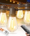 Close-up of LED Outdoor String Lights 25Ft With Edison Shatterproof Bulbs, remote in view, warm glow in a backyard setting.