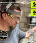 Premium Lightweight Frameless Safety Glasses with Killer Antifog Lens and Rock Solid Comfort for Marathon Shifts Bulk Box Includes 144 Pairs Green Gray used in industrial setting.