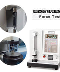 Compression springs assortment kit, stainless steel, 148 pieces in a case, 17 sizes, shown with force-test equipment.